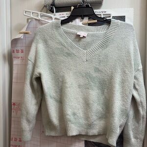 This sweater is in good condition and has no stains nor any rips or holes.